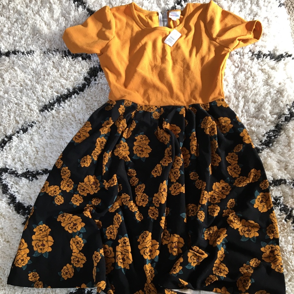 This is a Lula Rose girls dress in the size xl.